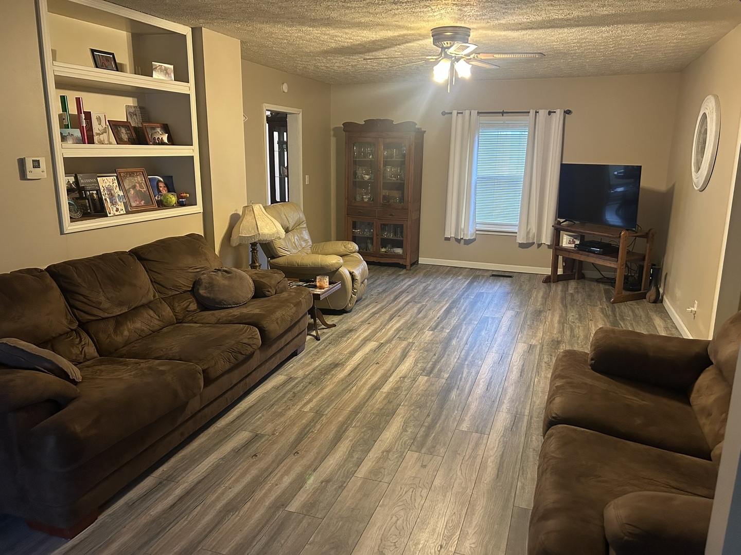 1 Bushwack Road Golconda, IL 62938 - Photo 16 of 38 a living room with furniture a flat screen tv and a fireplace