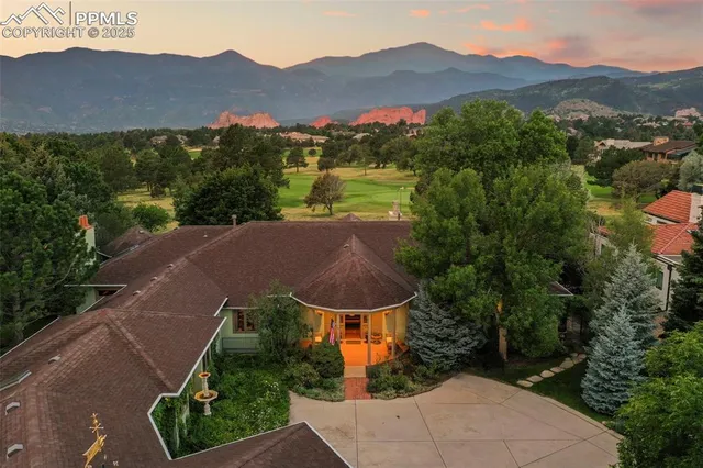 an aerial view of a house with a garden