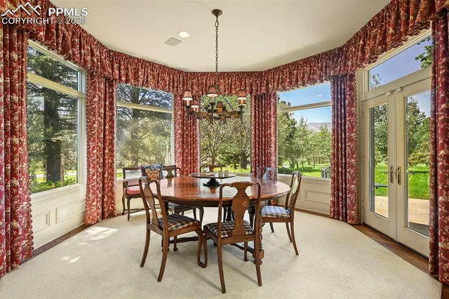 a dining room with furniture and window