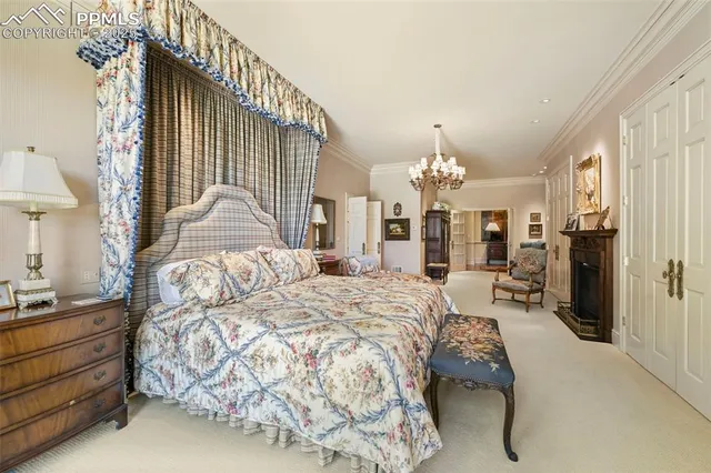 a bedroom with furniture and a fireplace