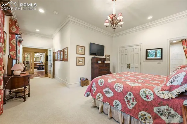 a bedroom with bed and window