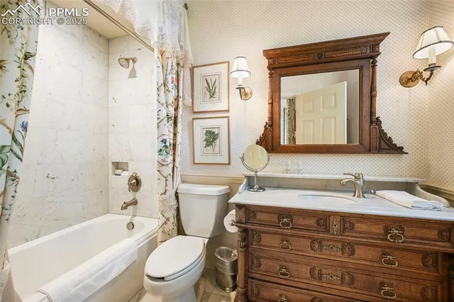 a bathroom with a toilet a sink and a bathtub