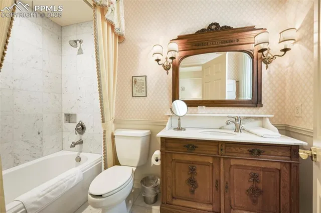 a bathroom with sink and mirror