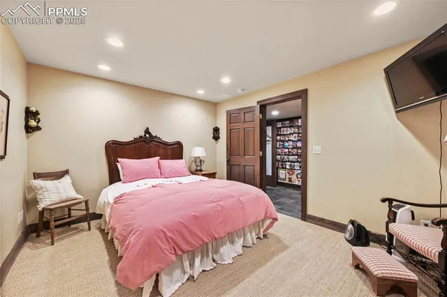 a living room with furniture a table tennis table and a flat screen tv