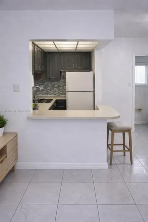 a hallway with washer and dryer