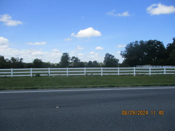 a view of a golf course with a road