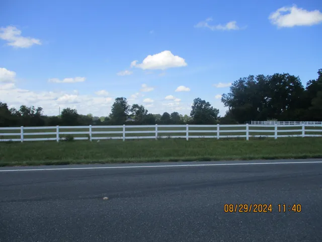 a view of a golf course with a road