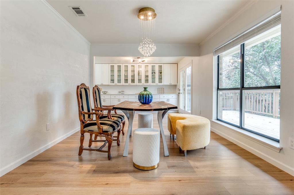9130 Valley Chapel Lane Dallas, TX 75220 - Photo 14 of 39 a dining room with furniture and wooden floor