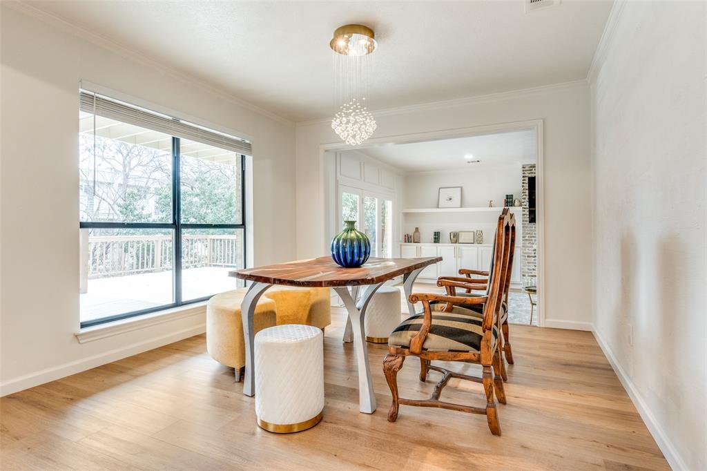 9130 Valley Chapel Lane Dallas, TX 75220 - Photo 15 of 39 a view of a dining room with furniture and wooden floor
