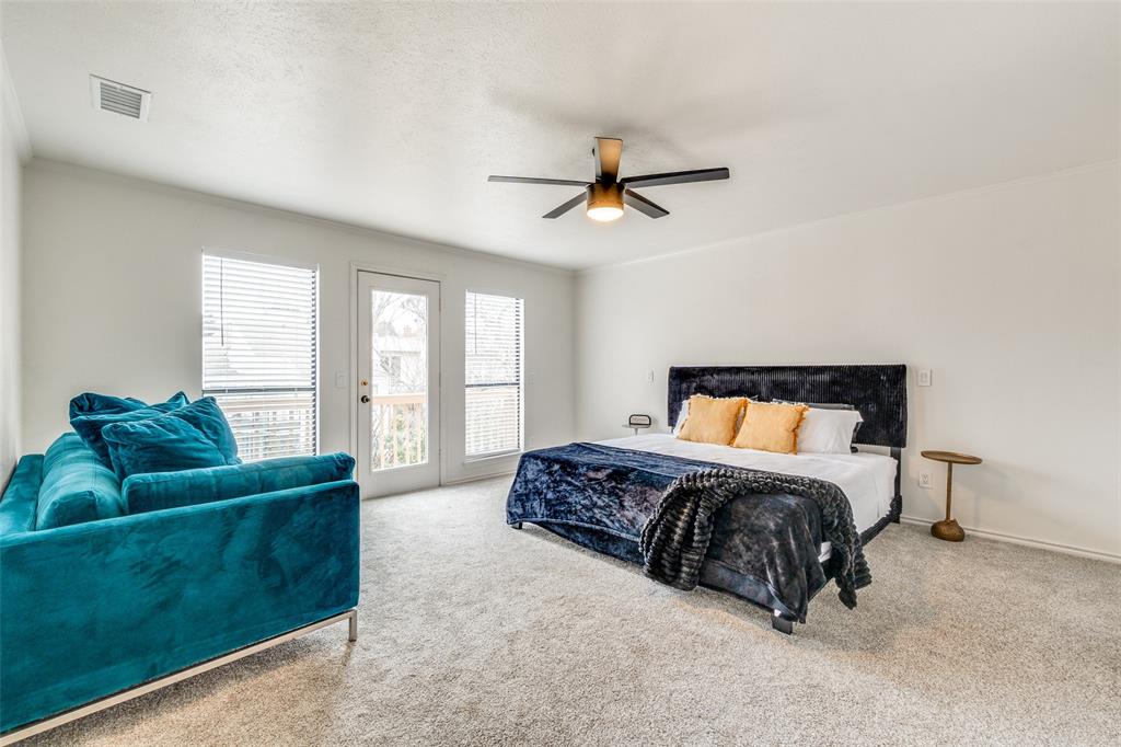 9130 Valley Chapel Lane Dallas, TX 75220 - Photo 22 of 39 a spacious bedroom with a bed a couch and a window