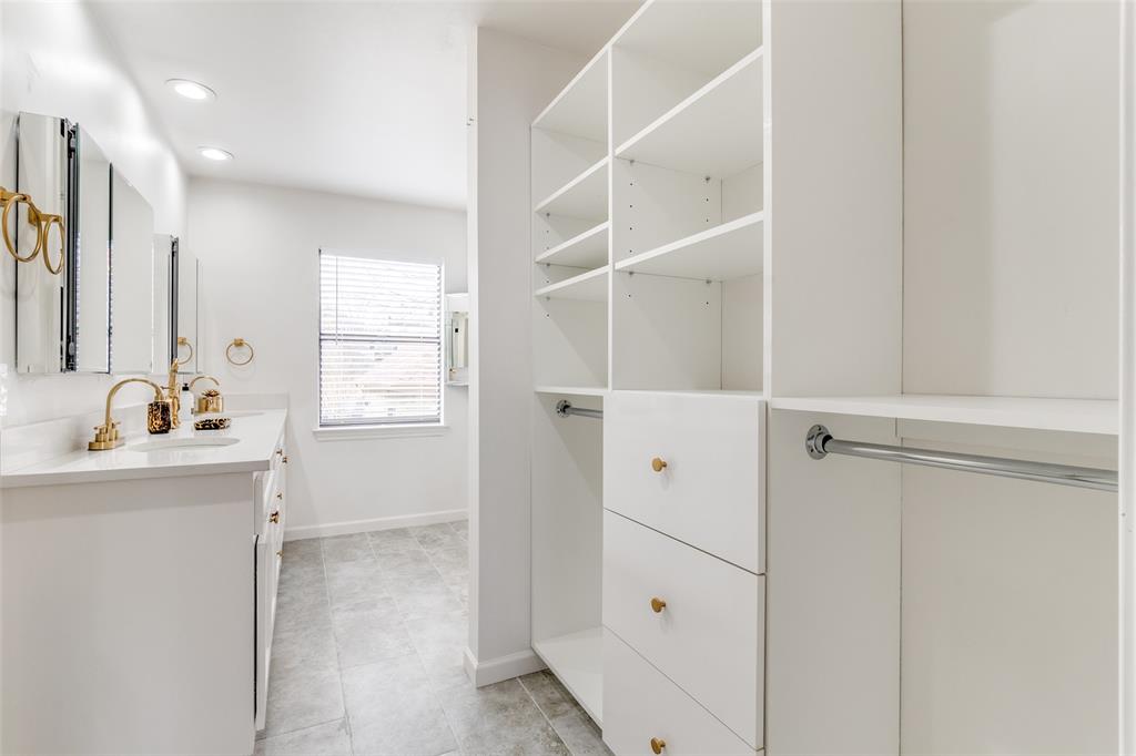 9130 Valley Chapel Lane Dallas, TX 75220 - Photo 25 of 39 a bathroom with a shower sink and mirror
