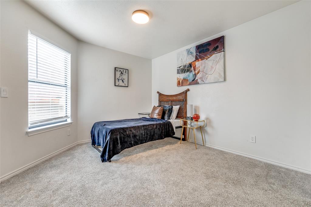 9130 Valley Chapel Lane Dallas, TX 75220 - Photo 30 of 39 a bedroom with a bed and a window