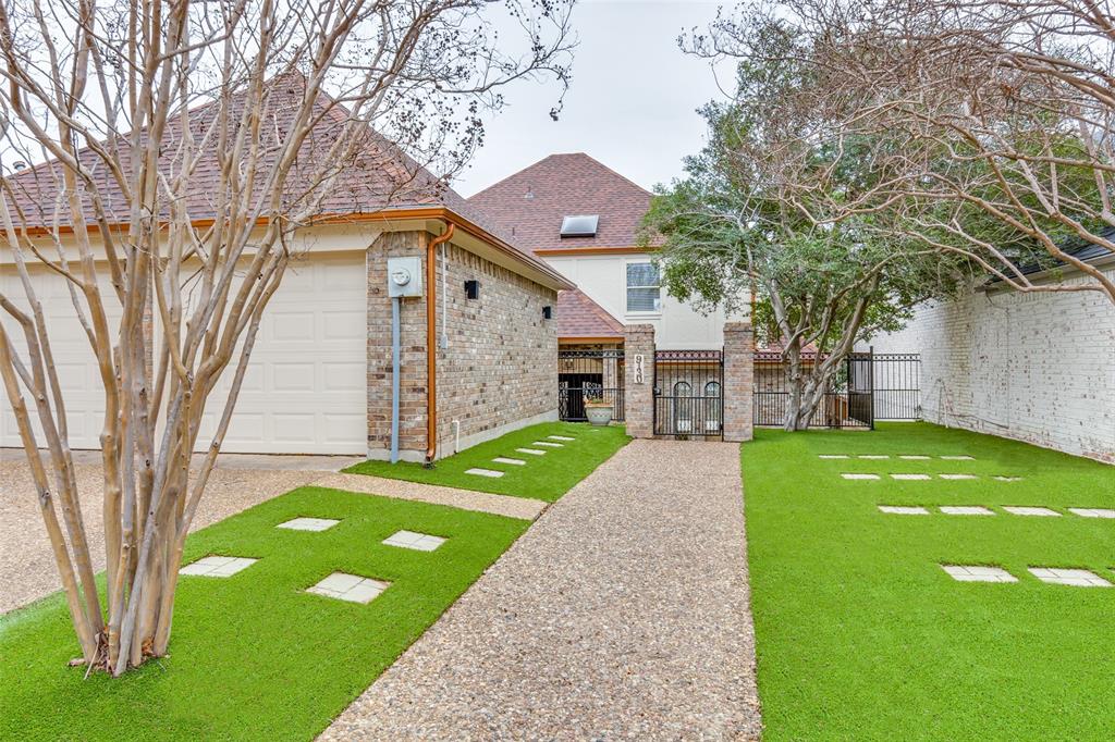 9130 Valley Chapel Lane Dallas, TX 75220 - Photo 3 of 39 a front view of a house with a garden and trees