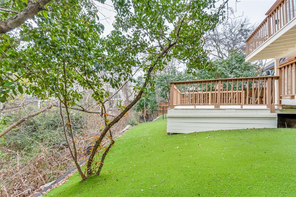 9130 Valley Chapel Lane Dallas, TX 75220 - Photo 35 of 39 a view of a house with a yard deck and a small cabin