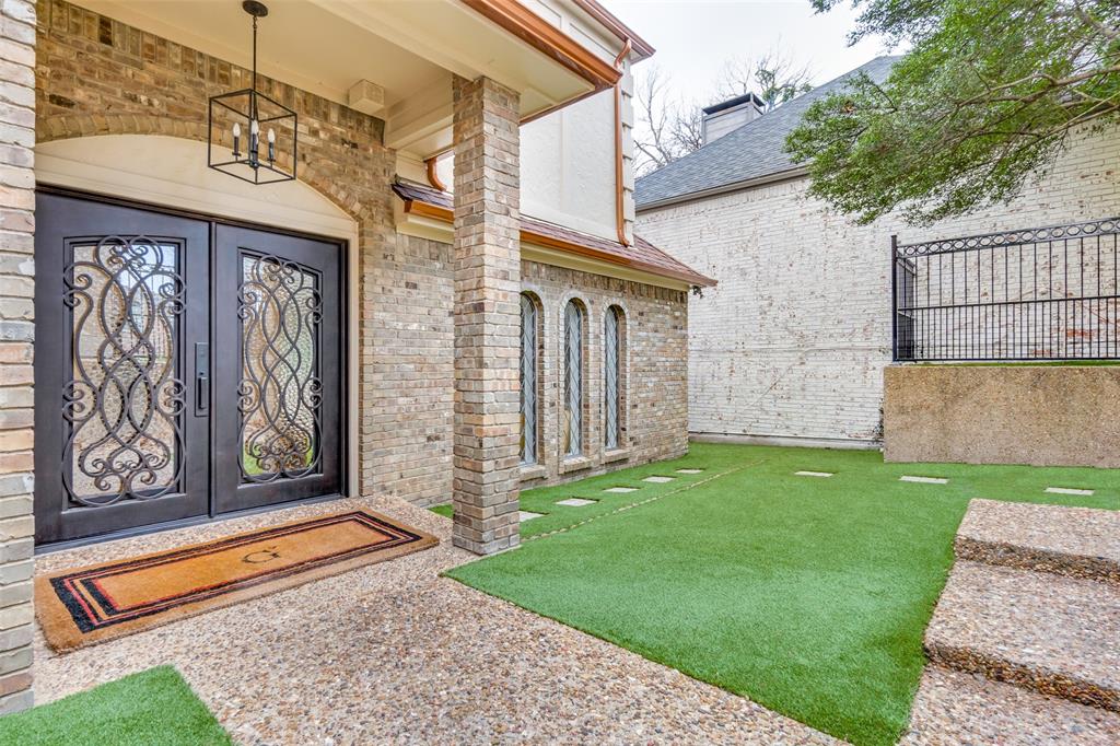 9130 Valley Chapel Lane Dallas, TX 75220 - Photo 5 of 39 a front view of a house with garden