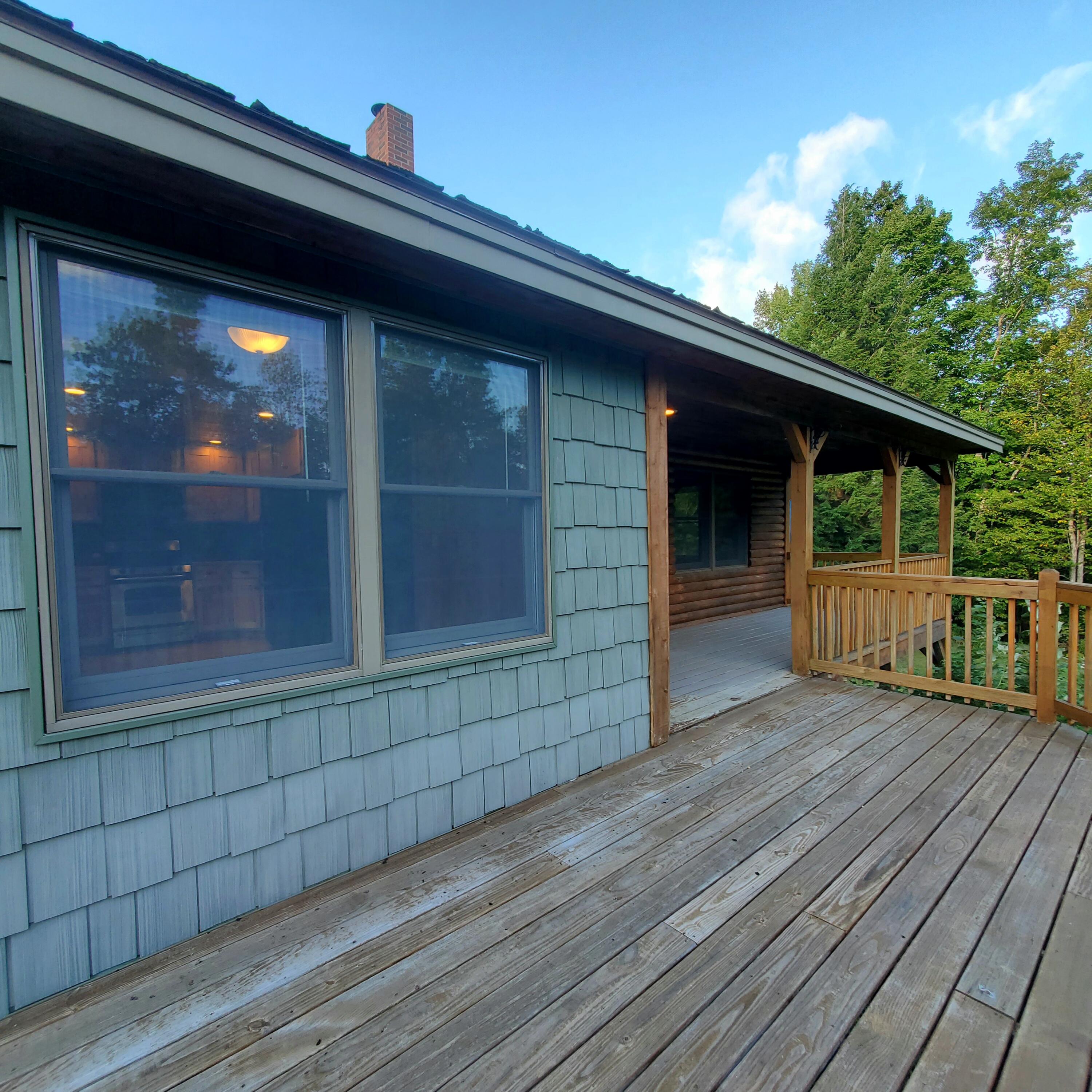 158 Kincaid Road Madison, ME 04950 - Photo 7 of 62 Wrap around deck toward covered porch