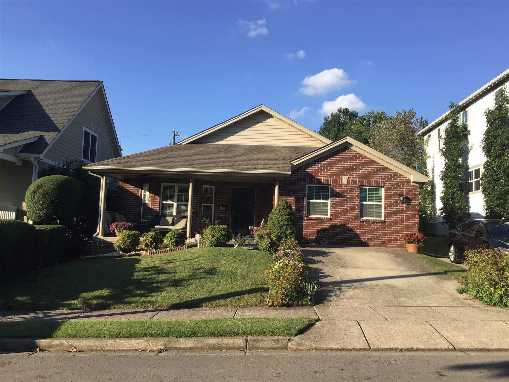 a front view of a house with garden
