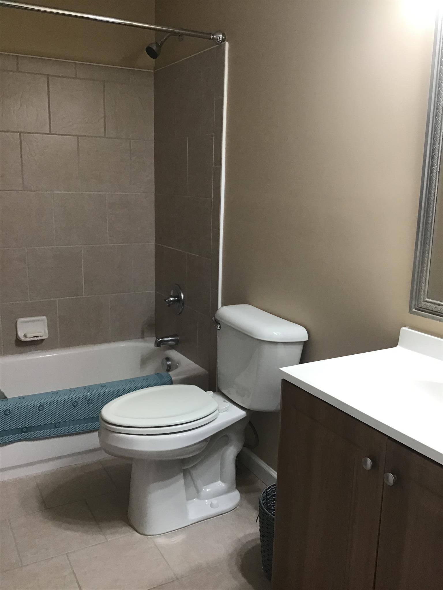 1108 Paris Avenue Nashville, TN 37204 - Photo 27 of 30 a bathroom with a sink a toilet and shower