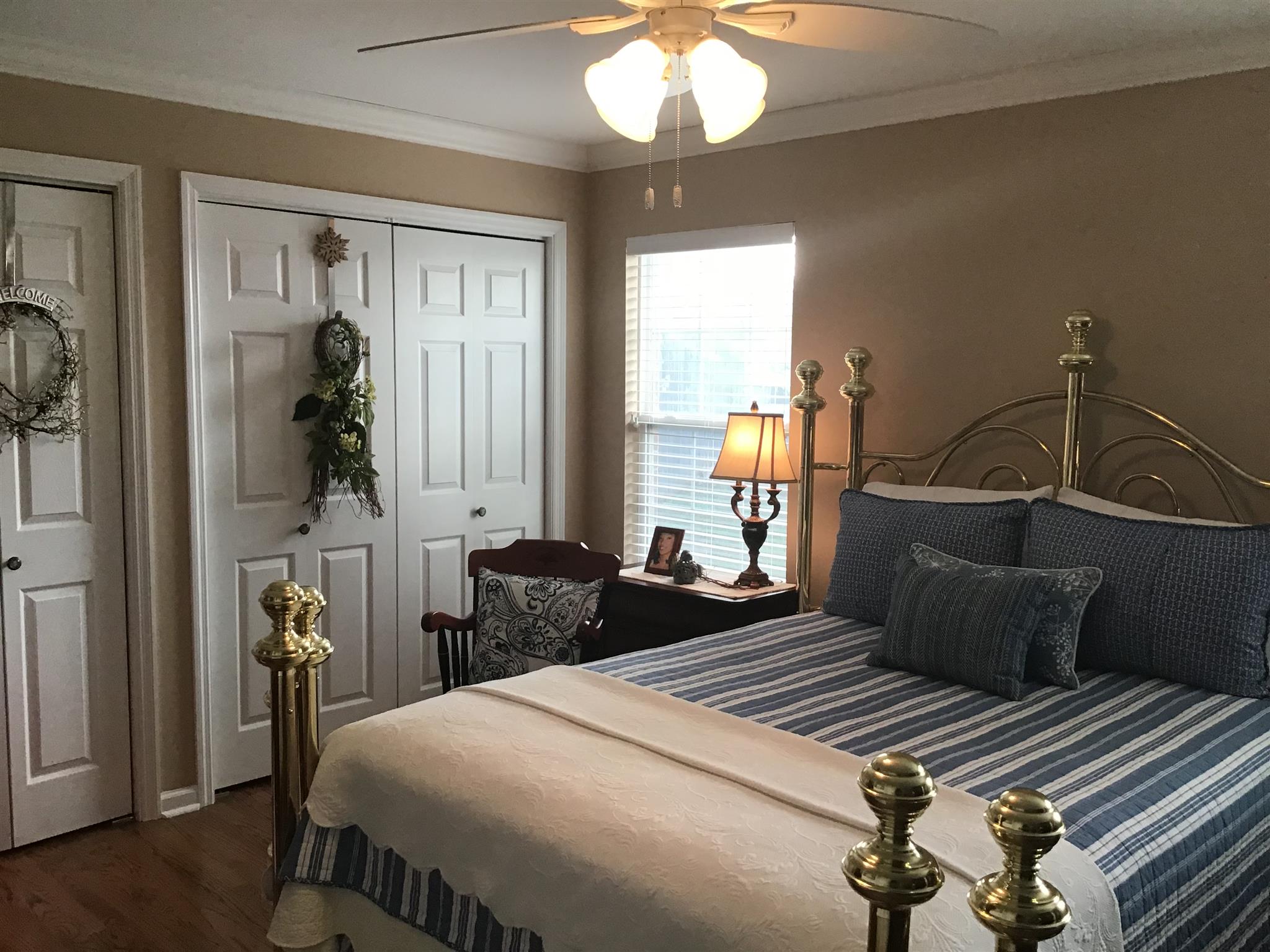 1108 Paris Avenue Nashville, TN 37204 - Photo 10 of 30 a bedroom with a bed and a chandelier