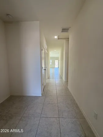 a view of hallway with a bathroom