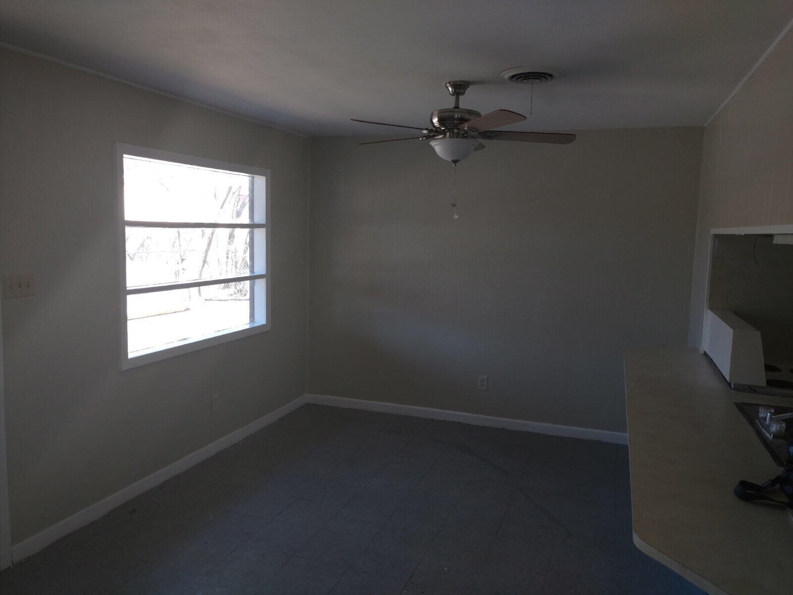 2812 43rd Street, Unit 7 Lubbock, TX 79413 - Photo 2 of 5 an empty room with a window