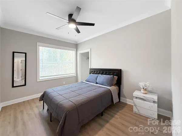 a bedroom with bed and window