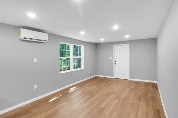 a view of an empty room with a window