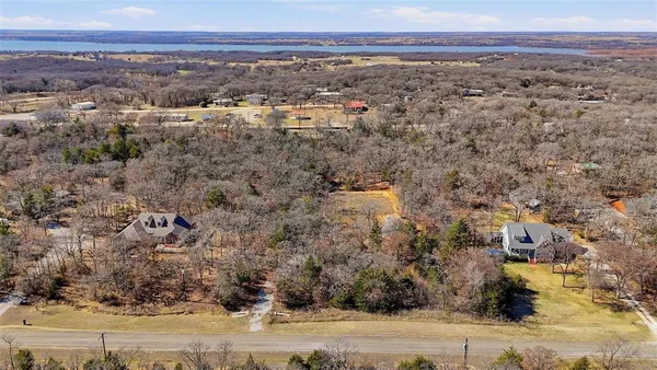 a view of yard covered with snow in front of house