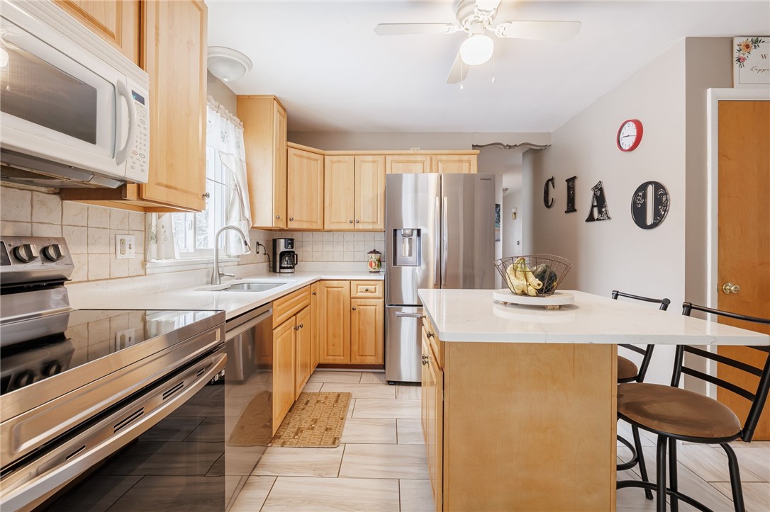 1572 Scribner Road Penfield, NY 14526 - Photo 15 of 32 Kitchen with eat-in island.