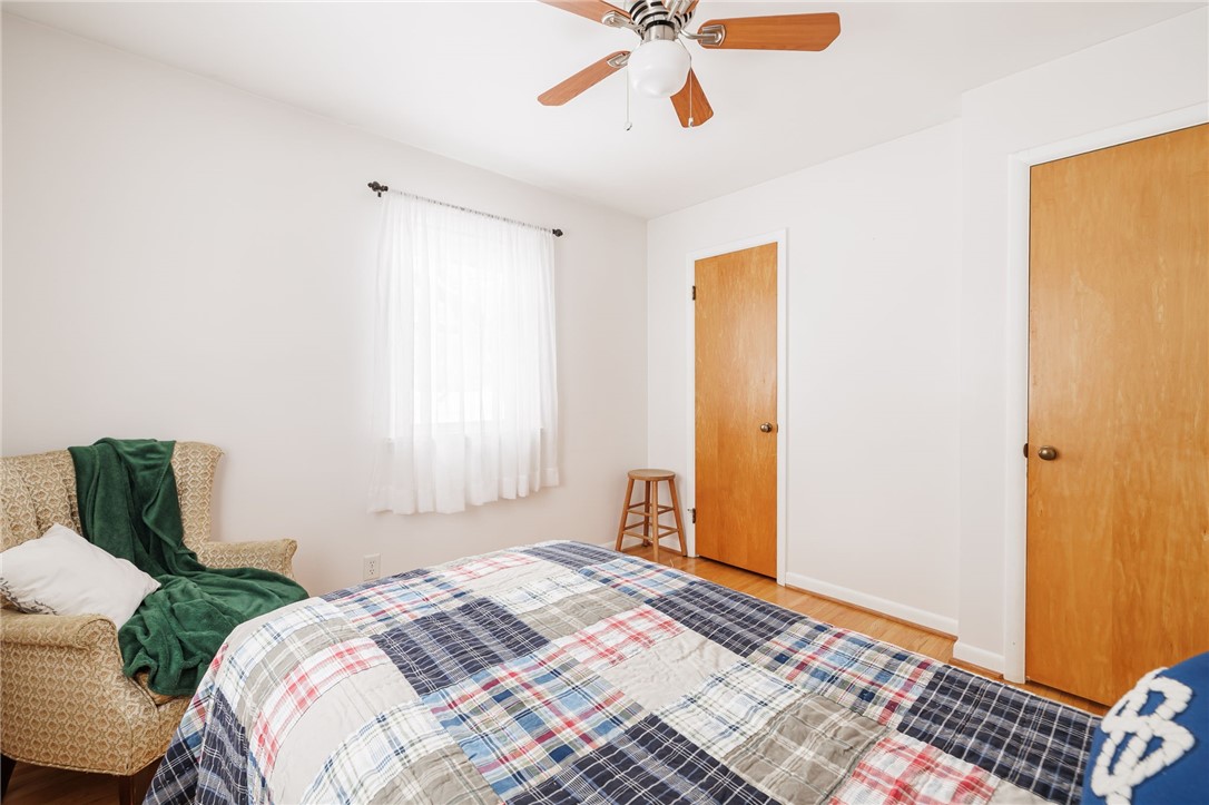 1572 Scribner Road Penfield, NY 14526 - Photo 21 of 32 @nd bedroom showing closet and ceiling fan.