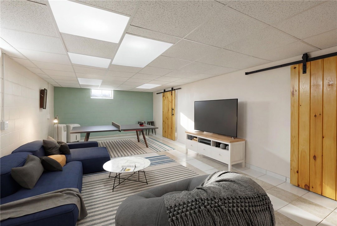 1572 Scribner Road Penfield, NY 14526 - Photo 26 of 32 Finished basement space virtually staged.