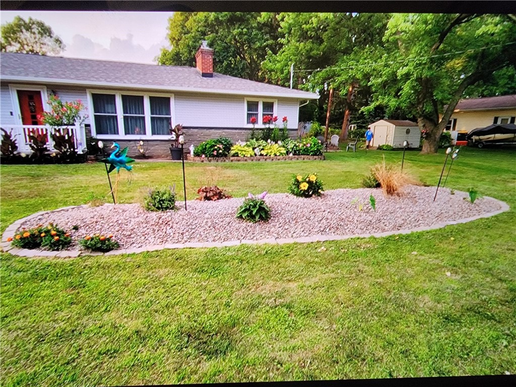 1572 Scribner Road Penfield, NY 14526 - Photo 4 of 32 Planting beds in Spring or summer.
