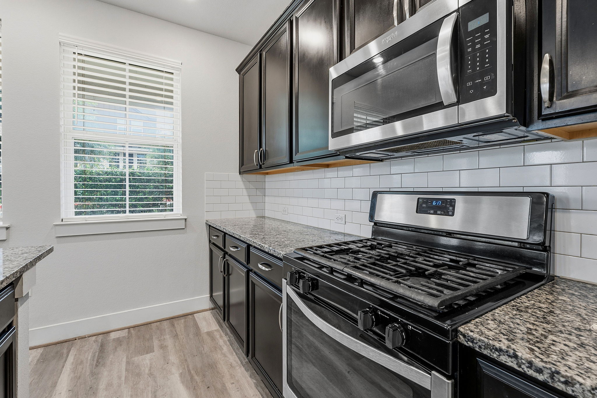 7105 Silver Star Lane, Unit 59 Austin, TX 78744 - Photo 6 of 19 a stove top oven sitting inside of a kitchen
