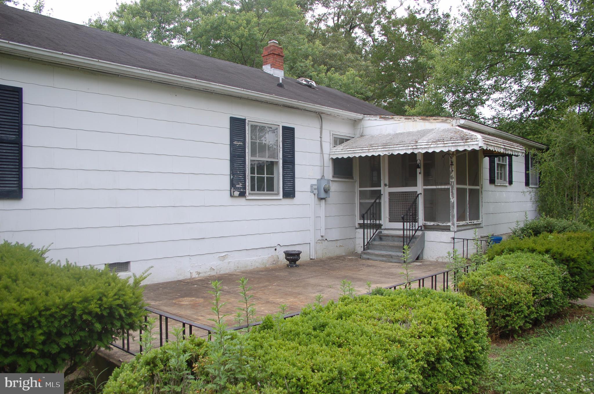 9085 Dahlgren Road King George, VA 22485 - Photo 23 of 28 Concrete Patio & Screened in Rear Porch