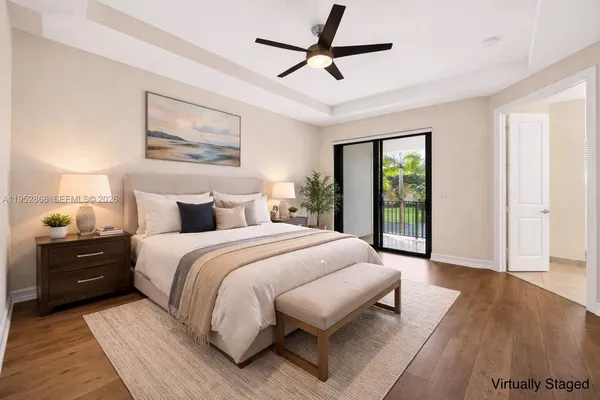 a bedroom with a bed and a large mirror