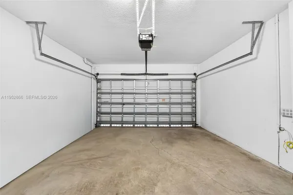 a view of empty room with ceiling fan