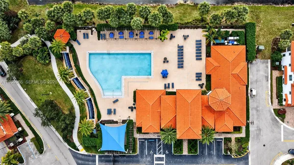 an aerial view of residential houses with outdoor space