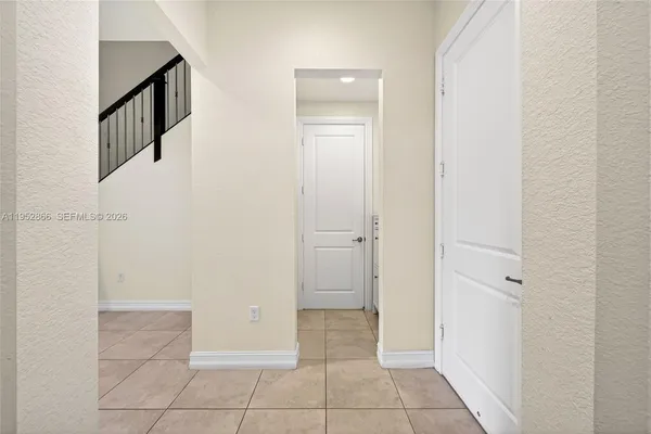 a view of an entryway with hallway