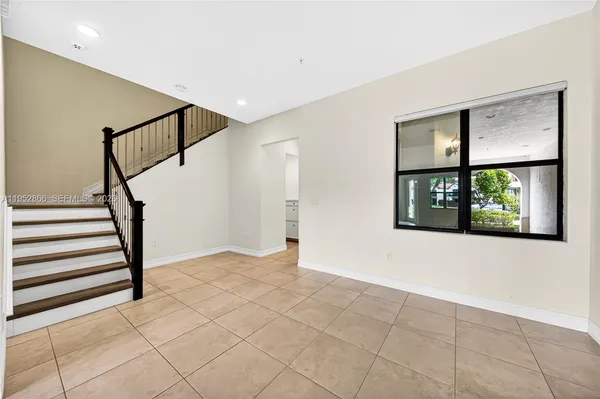 a view of an entryway with wooden floor