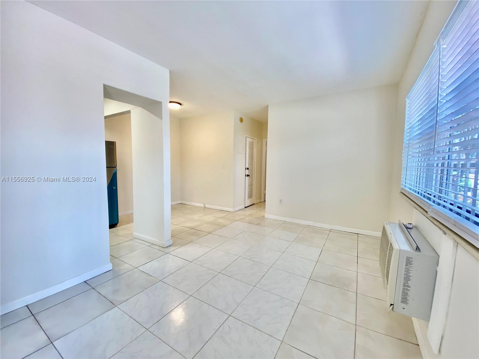 7625 Harding Avenue, Unit 1 Miami Beach, FL 33141 - Photo 3 of 11 a view of livingroom with hallway
