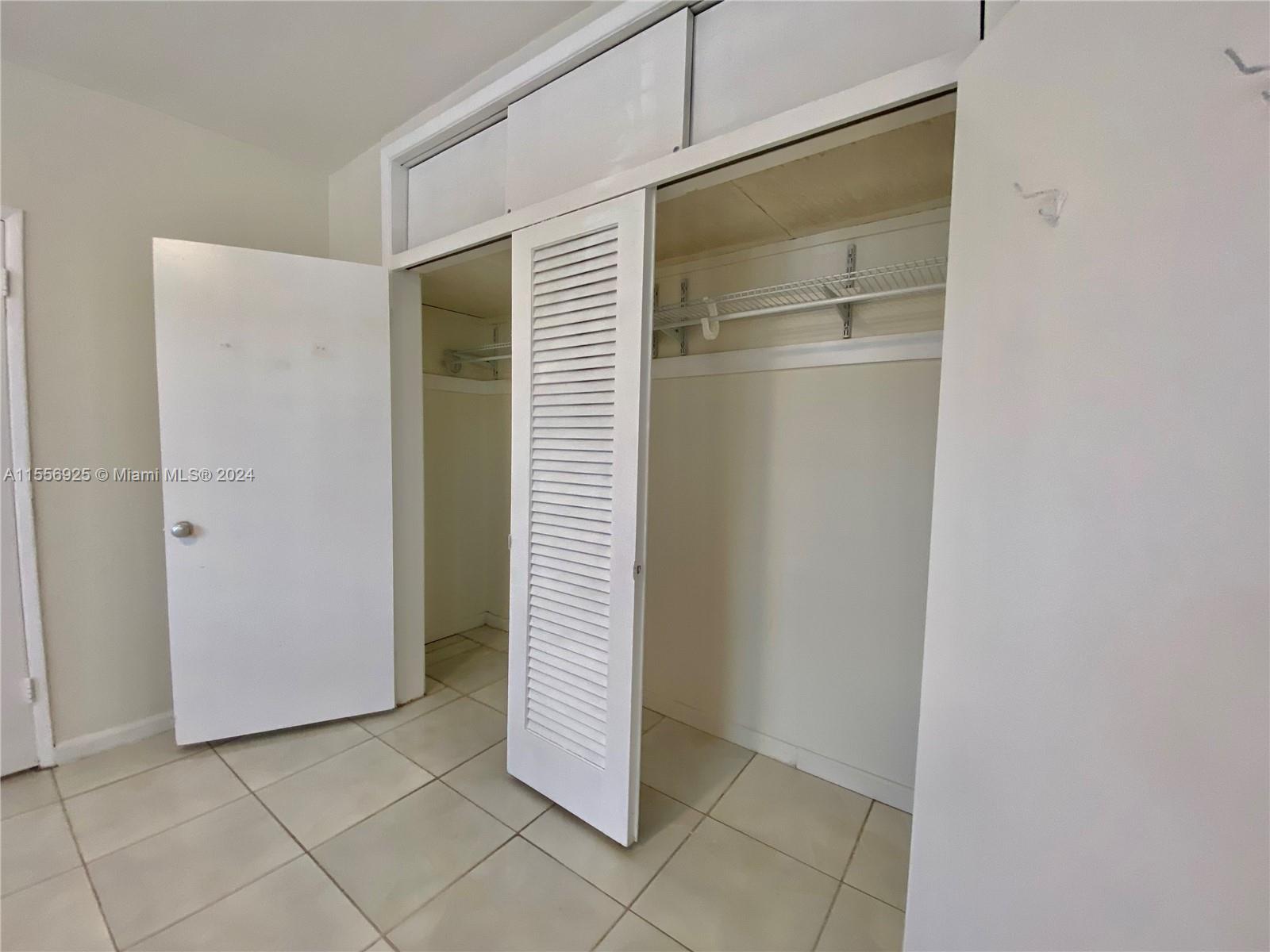 7625 Harding Avenue, Unit 1 Miami Beach, FL 33141 - Photo 9 of 11 a view of an empty room with closet
