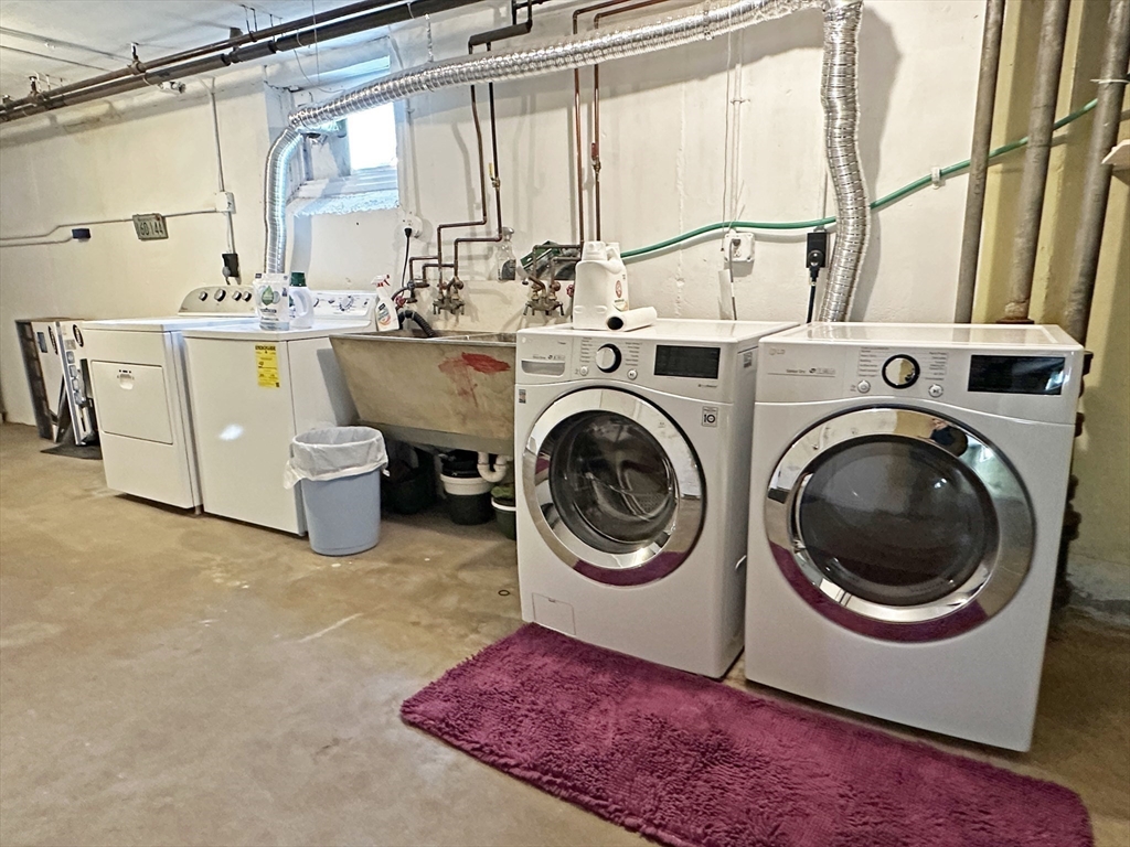 99 Withington Road Newton, MA 02460 - Photo 26 of 33 a utility room with dryer and washer