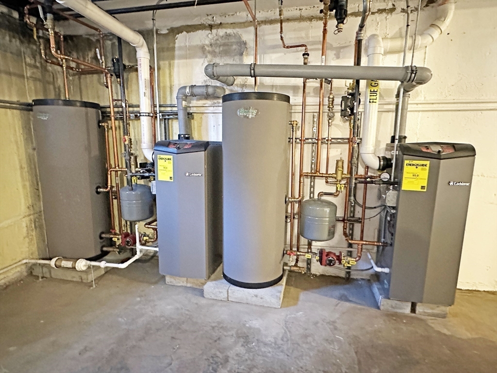 99 Withington Road Newton, MA 02460 - Photo 28 of 33 a view of a room with water heater and storage