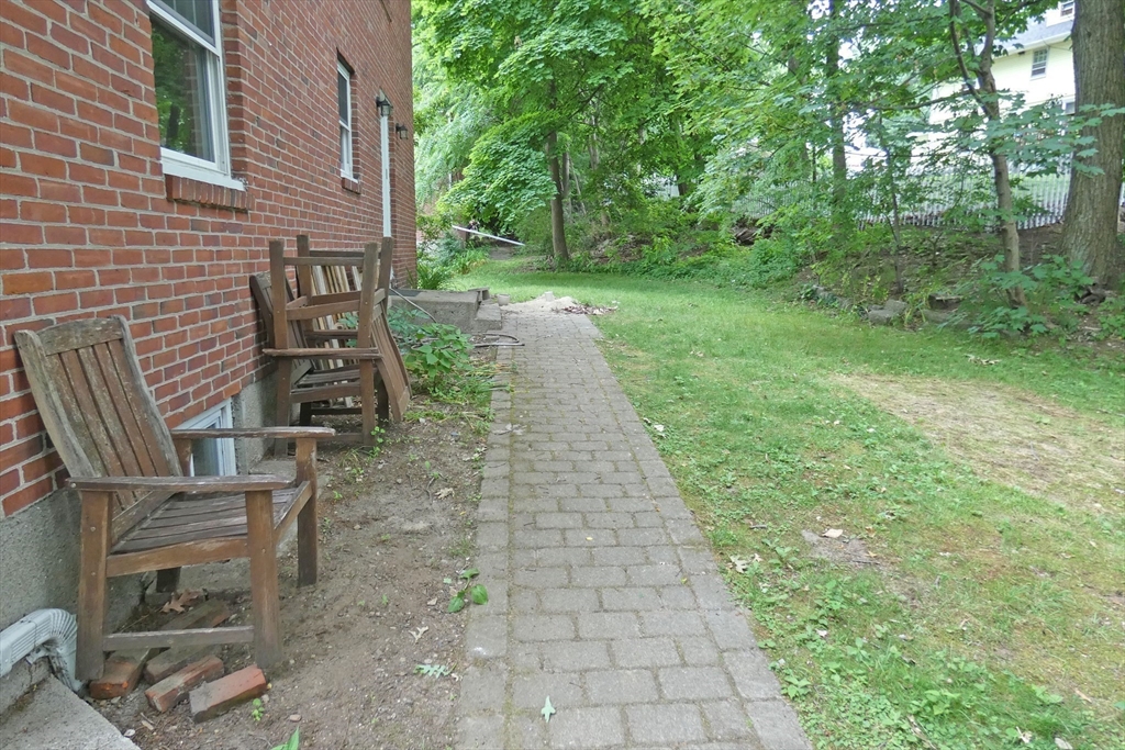 99 Withington Road Newton, MA 02460 - Photo 29 of 33 a view of a pathway with a backyard