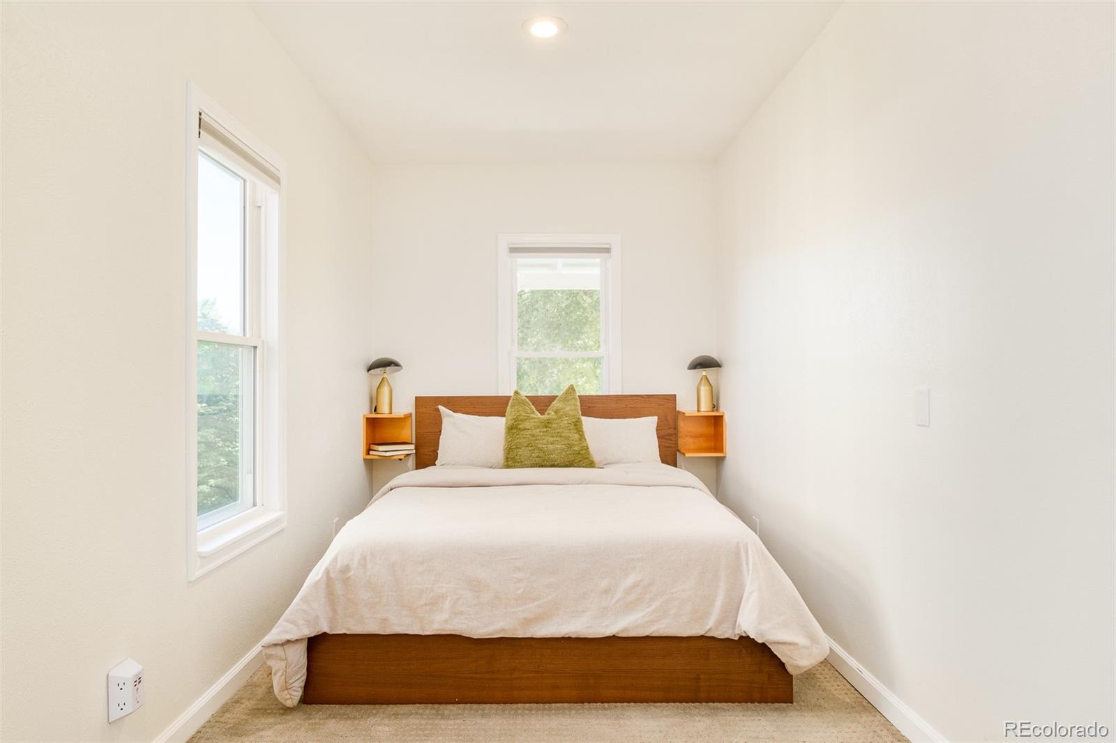 4635 Elm Court Denver, CO 80211 - Photo 12 of 28 a bedroom with a bed and window