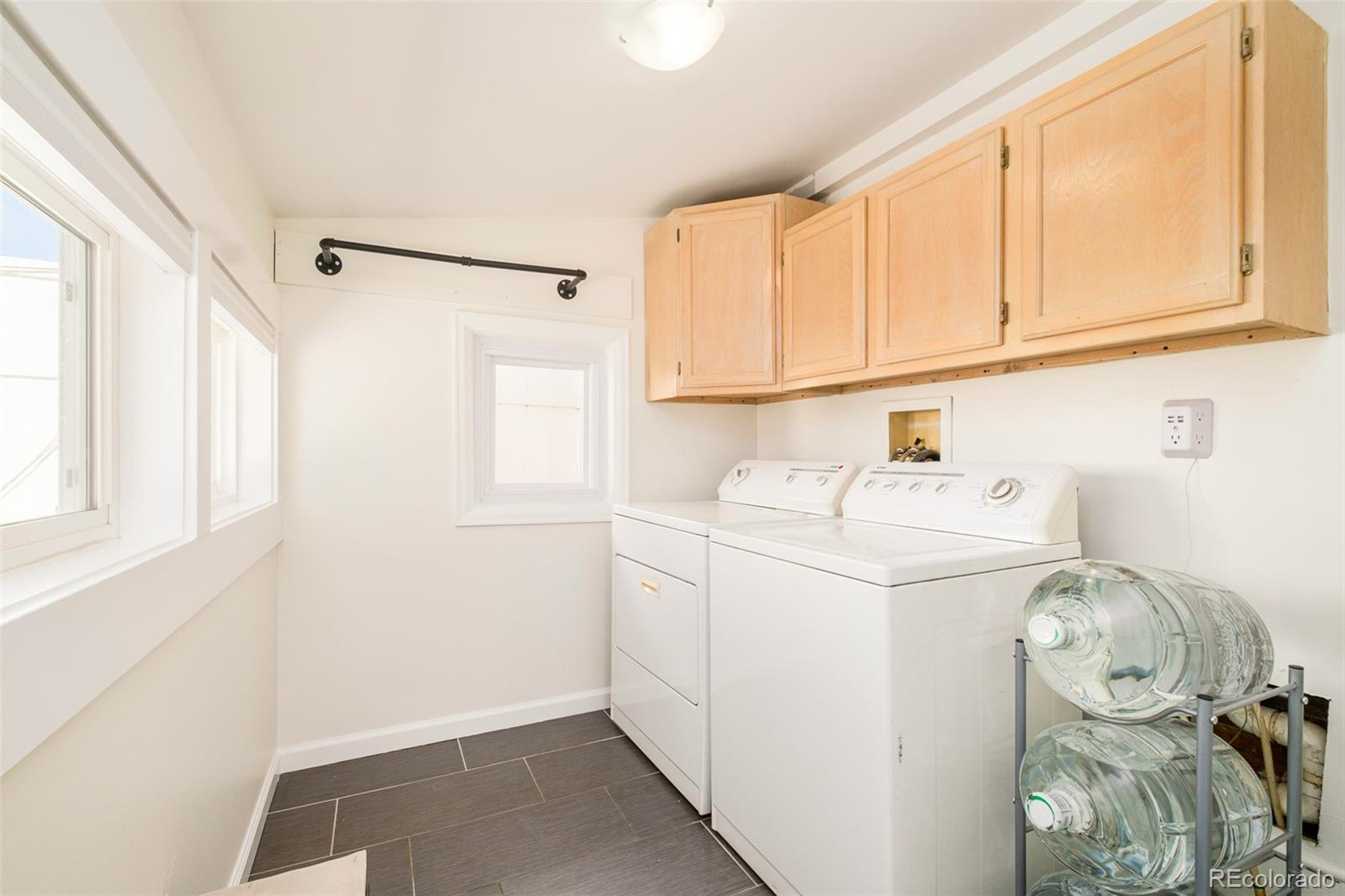 4635 Elm Court Denver, CO 80211 - Photo 17 of 28 a utility room with dryer and washer