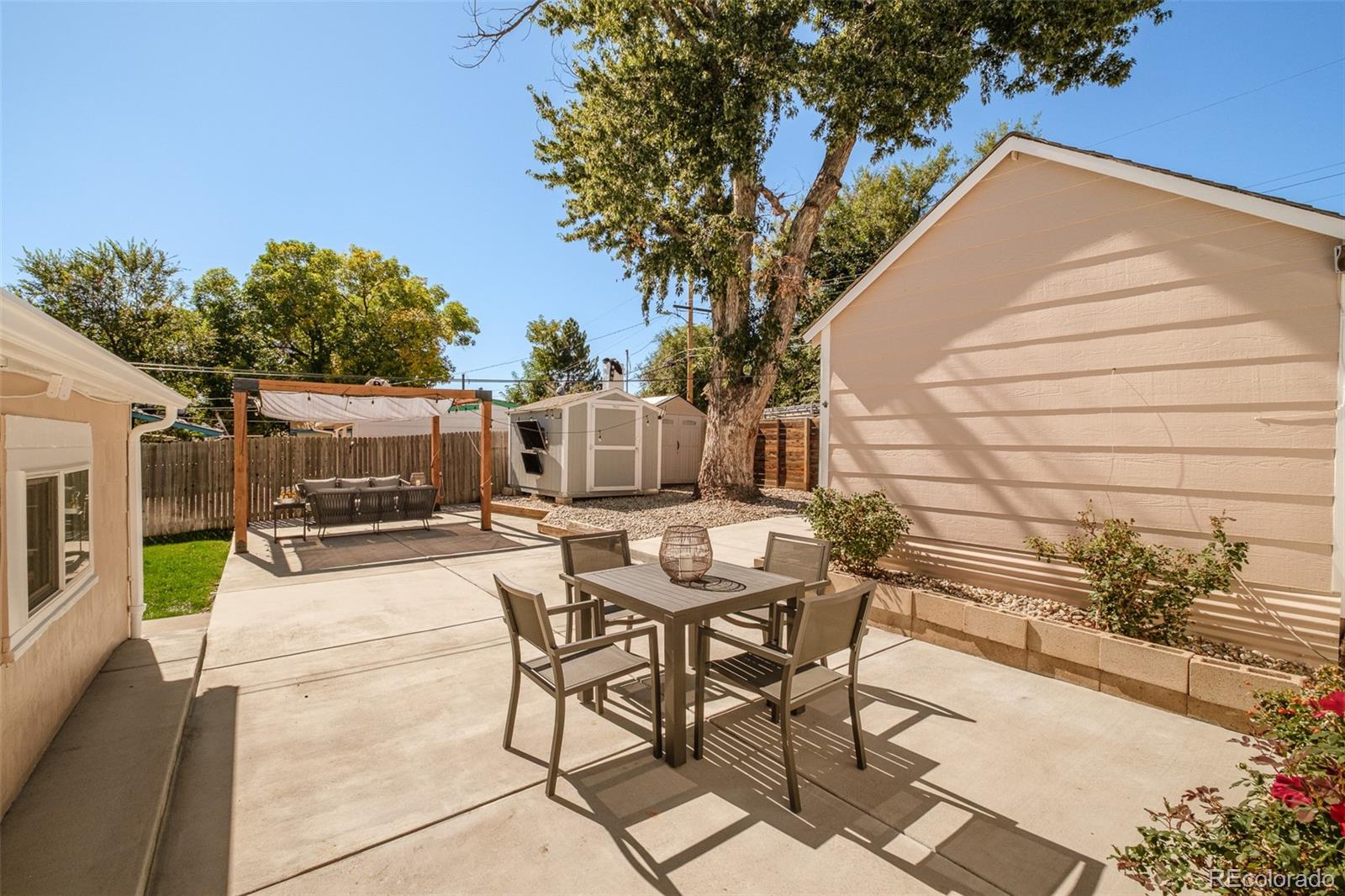 4635 Elm Court Denver, CO 80211 - Photo 21 of 28 a view of a patio with table and chairs and potted plants