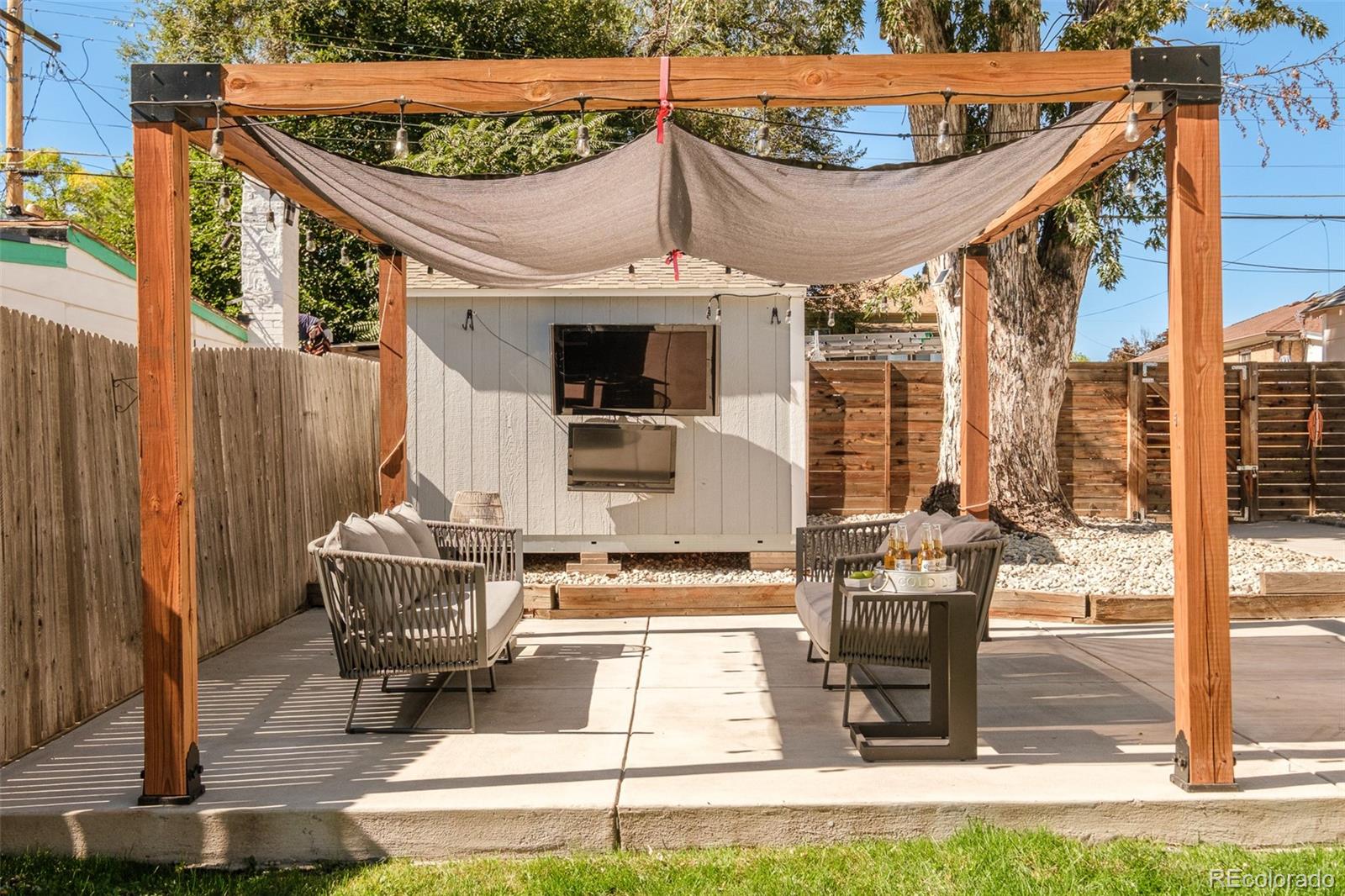 4635 Elm Court Denver, CO 80211 - Photo 22 of 28 a roof deck with table and chairs