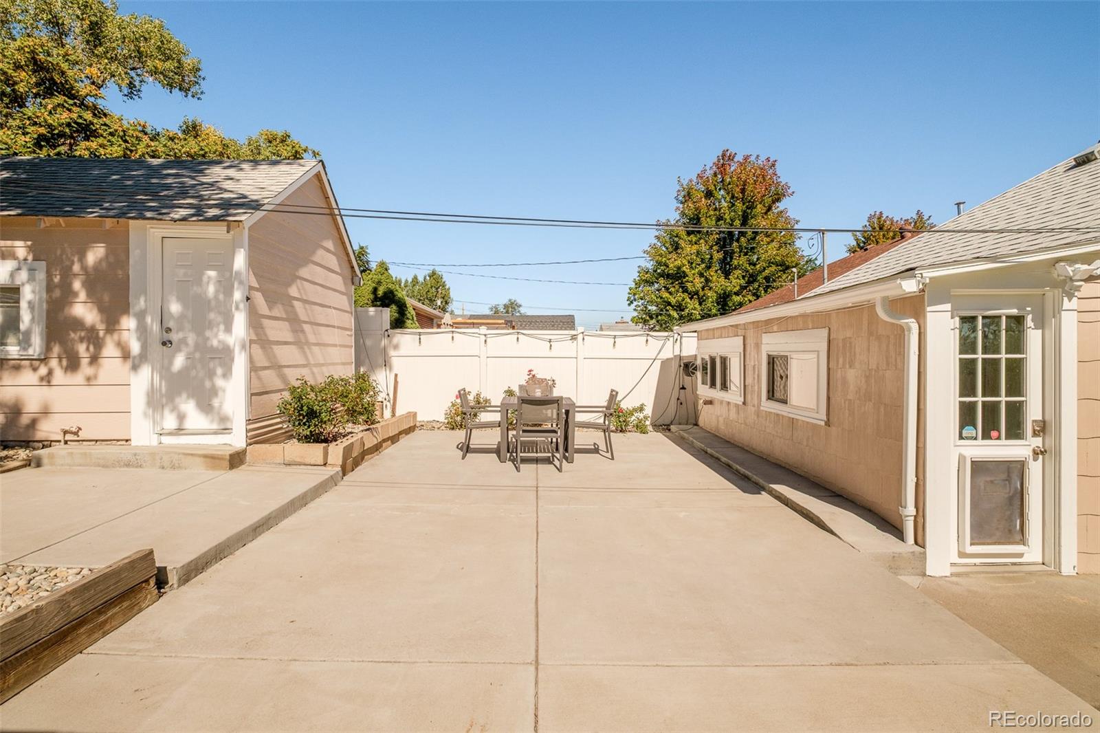 4635 Elm Court Denver, CO 80211 - Photo 25 of 28 a view of a patio with table and chairs and potted plants