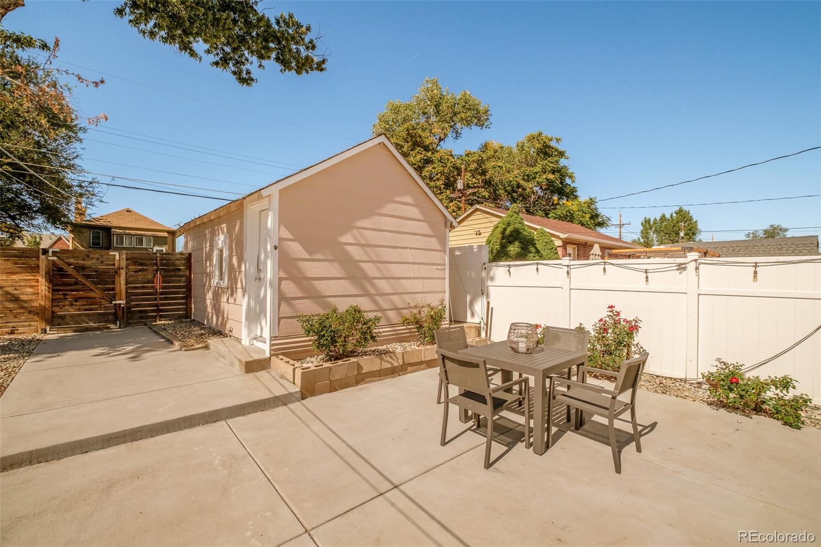 4635 Elm Court Denver, CO 80211 - Photo 26 of 28 a view of a patio with table and chairs and potted plants